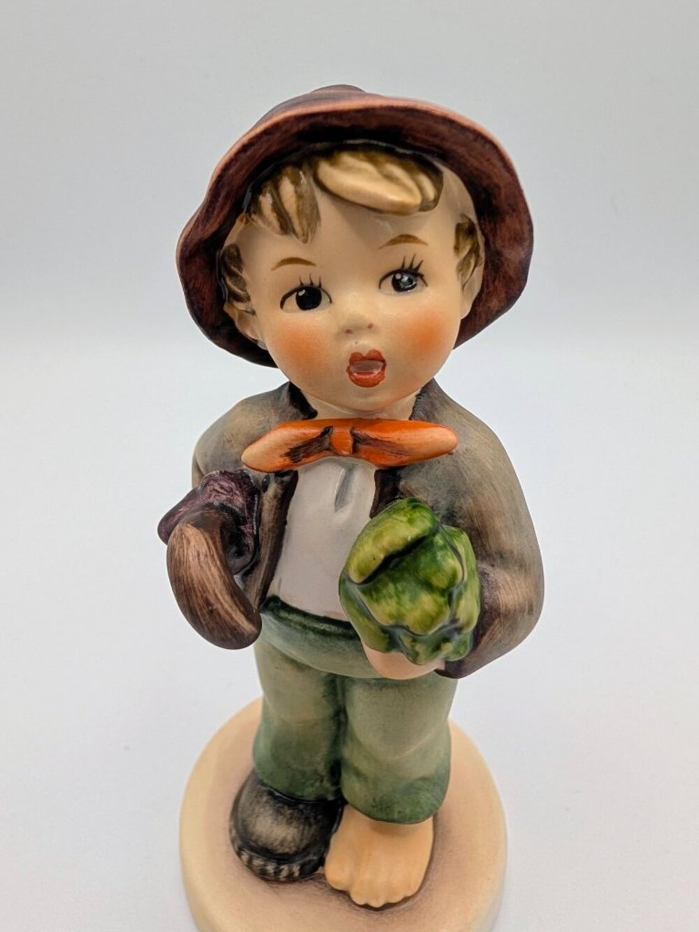 M.I. Hummel Figurine Titled "Lost Stocking" #374 - Vintage and Collectible